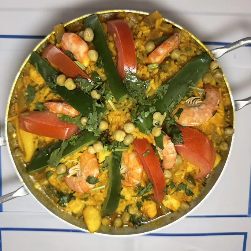 Shrimp and vegetable rice plated in the pan