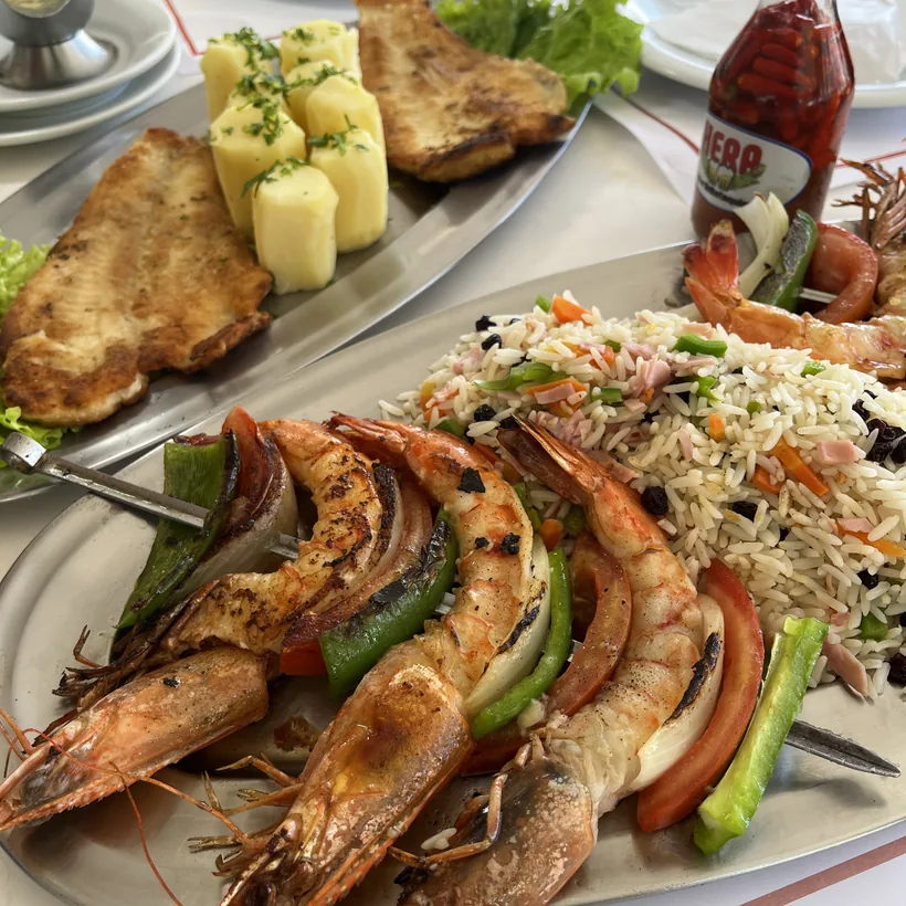 Grilled prawns and fish served with rice