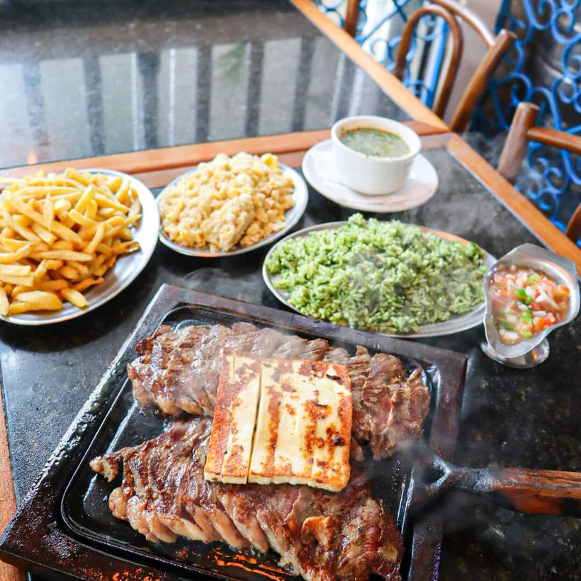 Picanha on the hot plate with grilled coalho cheese, fries and rice