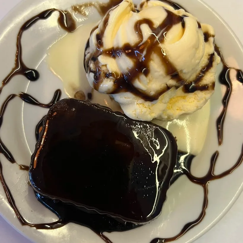 Brownie with ice cream seen from above