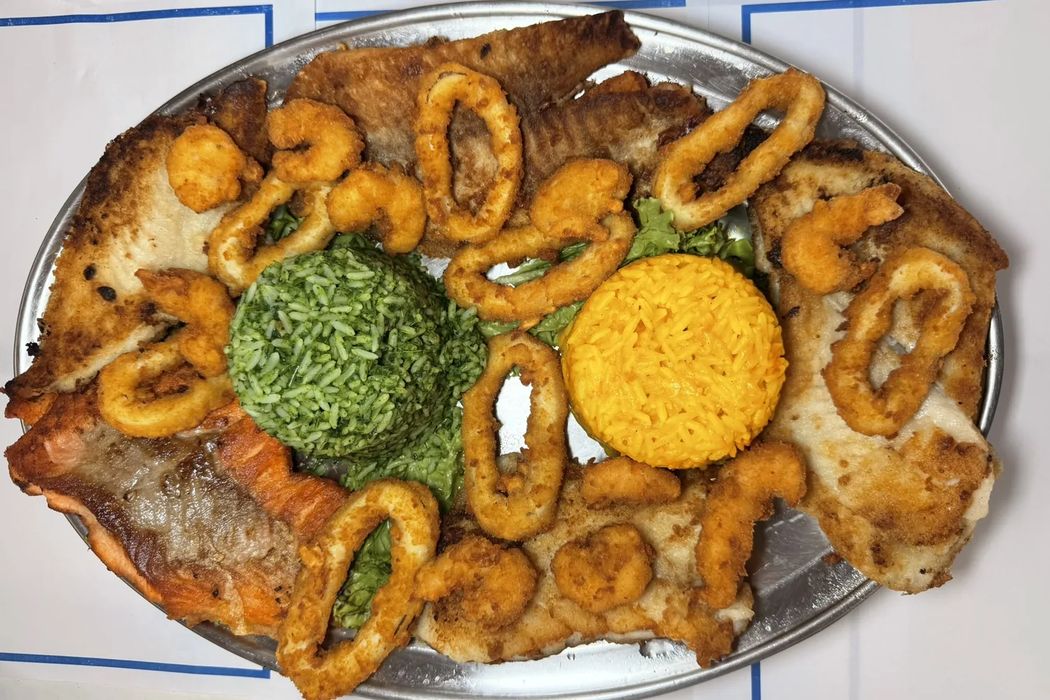 Hera's parrilhada with salmon, white fish fillets, squid and breaded shrimp
