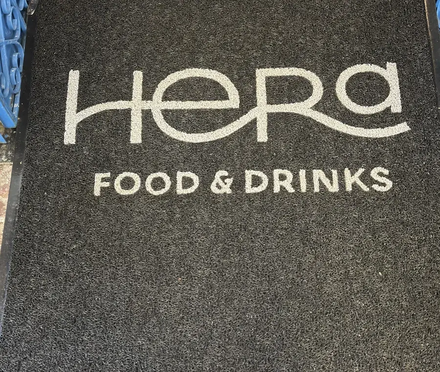 Hera Food and Drinks sign on the façade